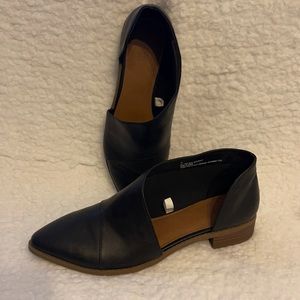 Black slip on shoes with side cut out